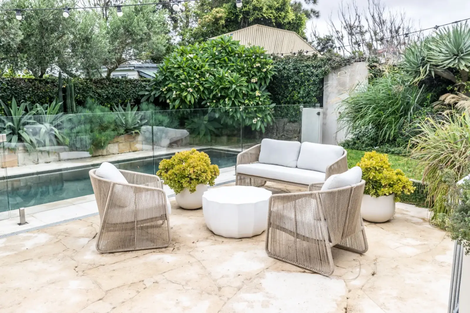 Bronte Pool - outdoor lounge with glass pool fencing and landscaping