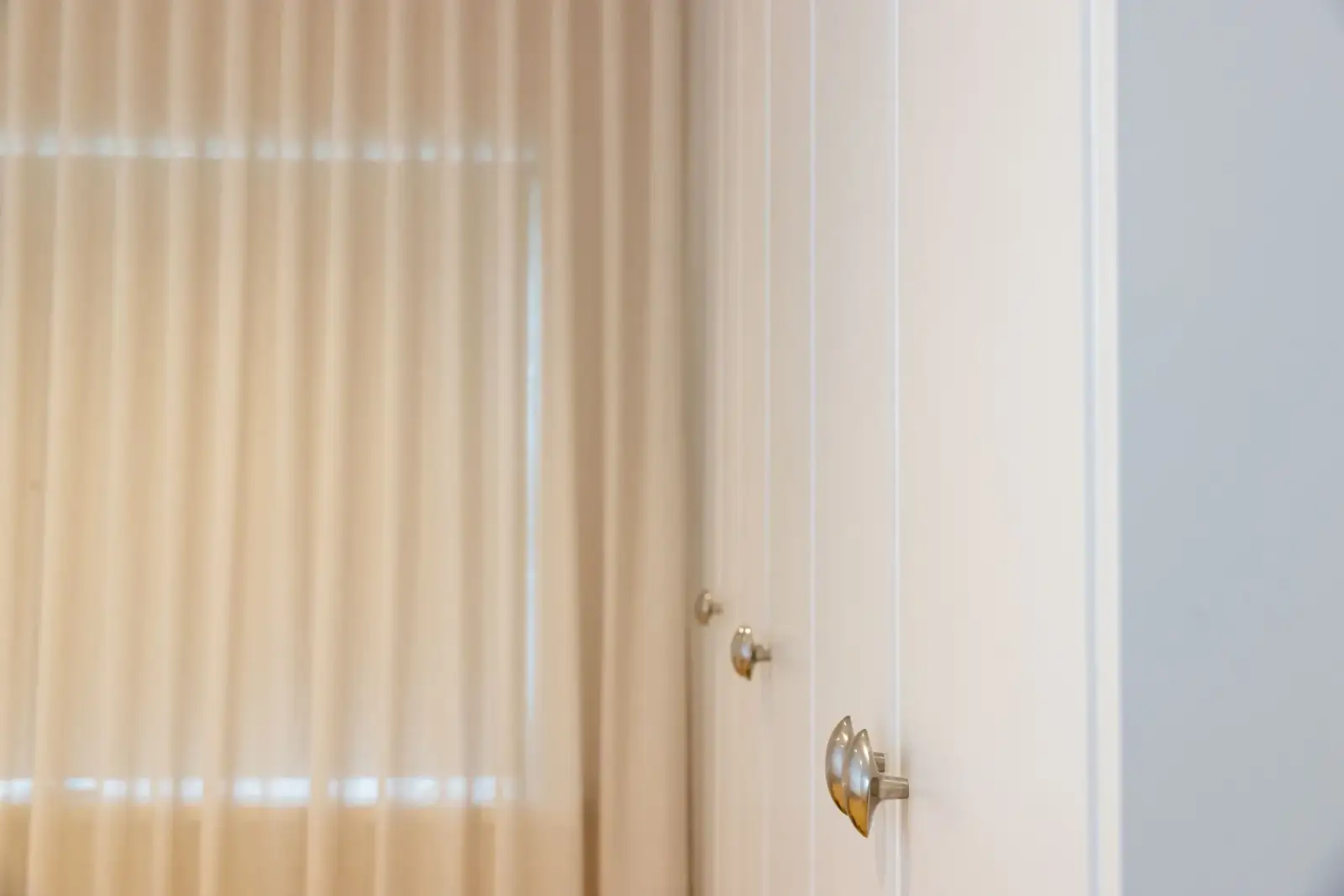 Eastern Project - fluted glass door with pewter hardware