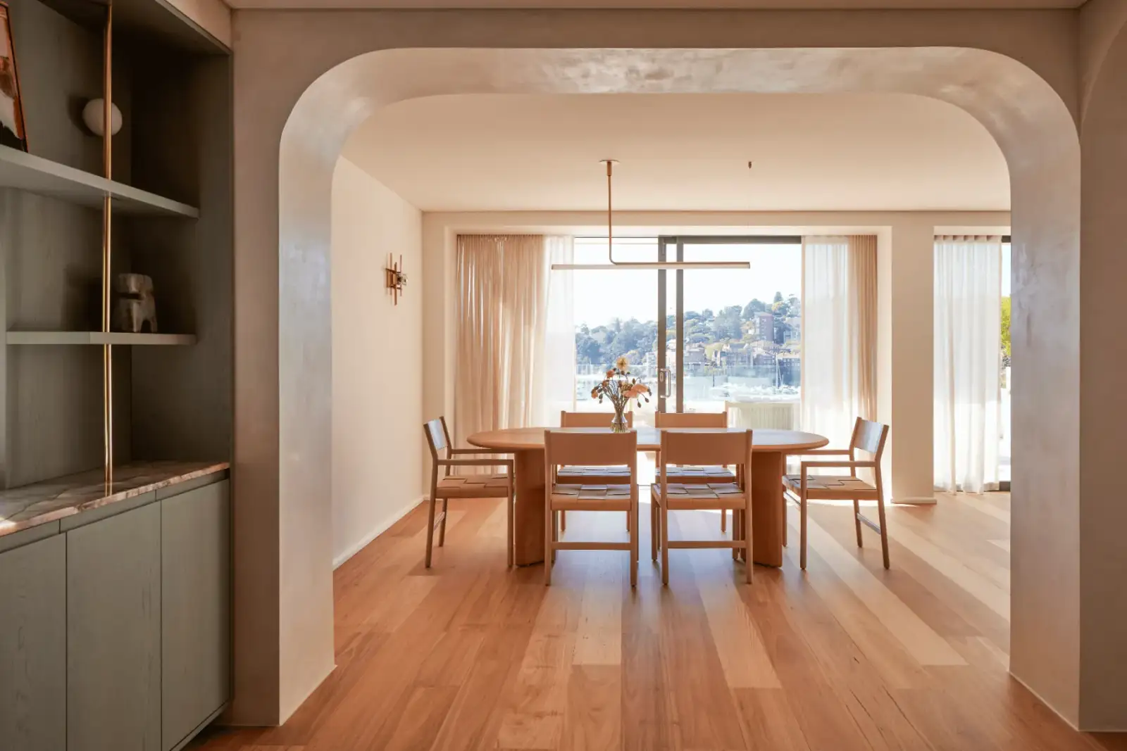 Sutherland Project - dining area framed by structural arches