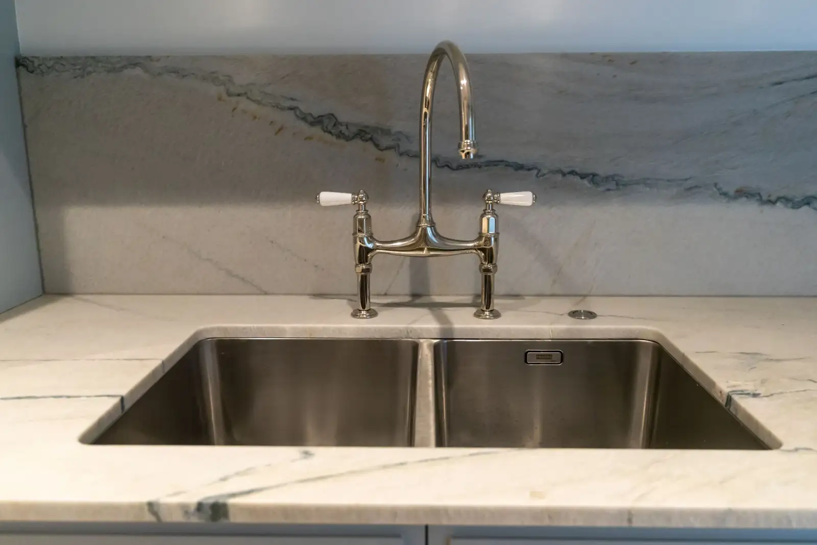 Eastern Project - quartzite kitchen sink with bridge tap