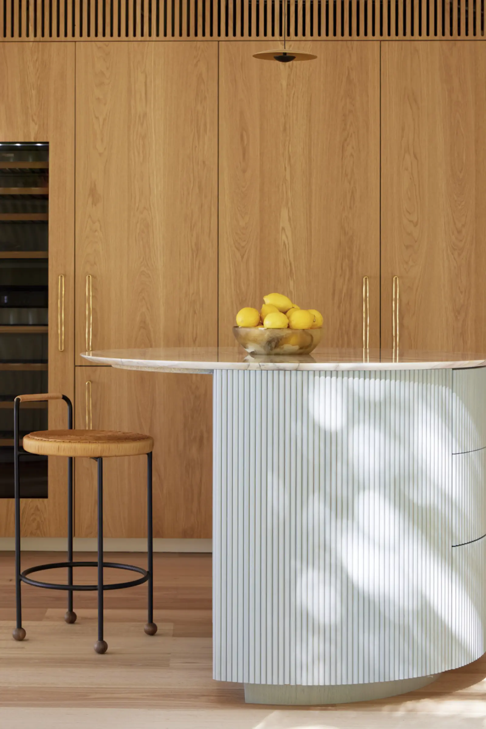 Bespoke kitchen island with fluted detailing and marble top